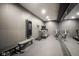 Home gym with mirrors, workout machines, and free weights for comprehensive fitness at 13947 Morningtide Cir, Fishers, IN 46038