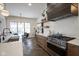 Modern kitchen with stainless steel appliances, an island, and ample natural light at 13947 Morningtide Cir, Fishers, IN 46038
