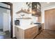 Beautiful kitchen with custom cabinets, quartz countertops, stainless appliances, and a modern range hood at 13947 Morningtide Cir, Fishers, IN 46038