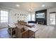 Cozy living room with hardwood floors, a modern fireplace, and comfortable seating at 13947 Morningtide Cir, Fishers, IN 46038