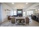 Inviting living room with hardwood floors, a cozy fireplace, and abundant natural light at 13947 Morningtide Cir, Fishers, IN 46038