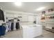 Spacious walk-in closet featuring custom shelving, ample storage, and bright lighting at 13947 Morningtide Cir, Fishers, IN 46038