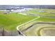 An aerial view showcases the proximity of the property to green spaces and a high school at 1405 Creekside Dr, Brownsburg, IN 46112