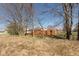 Spacious backyard with a wood fence and trees, providing privacy and a natural setting at 1405 Creekside Dr, Brownsburg, IN 46112