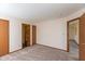 Bedroom with carpet flooring with an ensuite bathroom and closet at 1405 Creekside Dr, Brownsburg, IN 46112