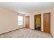 Spacious bedroom with neutral carpet, two closets, and an ensuite bathroom at 1405 Creekside Dr, Brownsburg, IN 46112