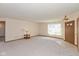 Inviting living room with carpet, a front door with sidelights, and neutral walls, offering a bright and airy feel at 1405 Creekside Dr, Brownsburg, IN 46112