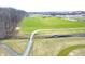 Aerial view of a recreational area featuring a bridge over a stream, near a school at 1405 Creekside Dr, Brownsburg, IN 46112