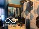 Compact bathroom featuring a mirror, vanity, and patterned shower curtain at 1405 N Mount St, Indianapolis, IN 46222