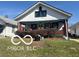 Charming single-story home with a covered front porch and well-maintained lawn, great curb appeal at 1405 N Mount St, Indianapolis, IN 46222