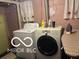 Laundry room with a washer, dryer, ironing board, and utility sink at 1405 N Mount St, Indianapolis, IN 46222