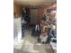 Cluttered, unfinished garage space with pegboard, tools, and workbench at 15192 Porchester Dr, Noblesville, IN 46062