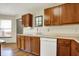 Functional kitchen with ample wooden cabinetry and modern appliances, designed for efficient meal preparation and storage at 15192 Porchester Dr, Noblesville, IN 46062