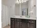 Bathroom features granite counters, dark wood cabinets, and a shower curtain at 1521 Avondale Dr, Westfield, IN 46074
