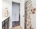 Neutral bathroom with a floral shower curtain, dark wood vanity and views into hallway at 1521 Avondale Dr, Westfield, IN 46074