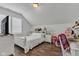 White bedroom with wood floors, shudders, bed, and decorative furnishings at 1521 Avondale Dr, Westfield, IN 46074