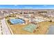 Aerial view showcasing community amenities: pool, tennis and basketball courts in landscaped setting at 1521 Avondale Dr, Westfield, IN 46074