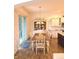 Cozy dining area featuring a table set for six with a view of the modern kitchen at 1521 Avondale Dr, Westfield, IN 46074