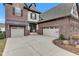 Spacious driveway leading to a two-car garage, highlighting the home's brick and siding exterior at 1521 Avondale Dr, Westfield, IN 46074