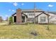 Inviting two-story home featuring a brick chimney and landscaped front yard at 1521 Avondale Dr, Westfield, IN 46074