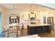 Open kitchen and dining area featuring an island, stainless steel appliances, and stylish decor at 1521 Avondale Dr, Westfield, IN 46074