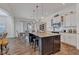 Eat-in kitchen with stainless appliances, granite countertops, large island with seating, and open layout at 1521 Avondale Dr, Westfield, IN 46074