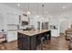 Beautiful kitchen features granite countertops, stainless steel appliances, and large island with seating at 1521 Avondale Dr, Westfield, IN 46074