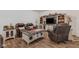 Comfortable living area with leather seating, entertainment center, and a rustic coffee table at 1521 Avondale Dr, Westfield, IN 46074