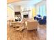 Spacious living room with a fireplace, hardwood floors, and comfortable seating arrangements at 1521 Avondale Dr, Westfield, IN 46074