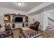 Inviting living room with a large entertainment center, leather recliners and stylish checkerboard table at 1521 Avondale Dr, Westfield, IN 46074