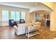 Cozy living room with shuttered windows, hardwood floors, and comfortable seating at 1521 Avondale Dr, Westfield, IN 46074