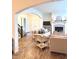 Open-concept living room with hardwood floors, fireplace, and view of the front entry at 1521 Avondale Dr, Westfield, IN 46074