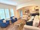 Bright living room featuring cozy furniture, hardwood floors, and a view into the dining area at 1521 Avondale Dr, Westfield, IN 46074