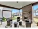 Comfortable outdoor living space with fireplace, open yard, and nice neighborhood views at 1521 Avondale Dr, Westfield, IN 46074