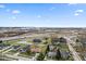 Aerial view displaying surrounding neighborhood, landscape and roads with highway visible in the distance at 1620 S East St, Lebanon, IN 46052