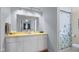 Bright bathroom featuring a vanity, mirror, shower with a decorative curtain for added privacy at 1620 S East St, Lebanon, IN 46052
