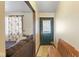 Inviting entryway with a bench, decorative door glass, and a glimpse into the cozy living area at 1620 S East St, Lebanon, IN 46052