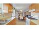 Open concept kitchen with wood cabinets overlooking dining area, ideal for gatherings and daily living at 1620 S East St, Lebanon, IN 46052