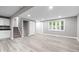Spacious finished basement with white cabinets, closet, and light wood floors at 1641 Whistler Terrace, Indianapolis, IN 46229