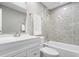 Bright bathroom with neutral tile, white vanity, and a bathtub-shower combination at 1641 Whistler Terrace, Indianapolis, IN 46229