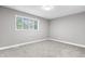 A spare bedroom with plush carpet and a window offering lots of natural light at 1641 Whistler Terrace, Indianapolis, IN 46229