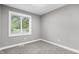 Empty bedroom with plush carpets and lots of natural light from the single window at 1641 Whistler Terrace, Indianapolis, IN 46229