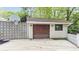 Detached garage with cement driveway and a basketball hoop at 1641 Whistler Terrace, Indianapolis, IN 46229