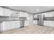 Modern kitchen with white cabinets, stainless steel appliances, herringbone backsplash and light wood floors at 1641 Whistler Terrace, Indianapolis, IN 46229