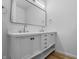 Bathroom featuring a double sink vanity, large mirror and modern lighting at 1822 N Dexter St, Indianapolis, IN 46202