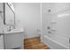 Bathroom featuring a double sink vanity and a shower-tub combo at 1822 N Dexter St, Indianapolis, IN 46202