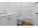 Bathroom featuring a white vanity with drawers and a shower-tub combo at 1822 N Dexter St, Indianapolis, IN 46202