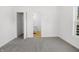 An empty bedroom with neutral carpeting, a closet, and an ensuite bathroom at 1822 N Dexter St, Indianapolis, IN 46202