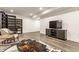 Finished basement space with vinyl floors, built in shelving, and a cozy seating area at 1955 Alvord St, Indianapolis, IN 46202