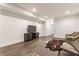 Finished basement space with vinyl floors, built in shelving, and a cozy seating area at 1955 Alvord St, Indianapolis, IN 46202